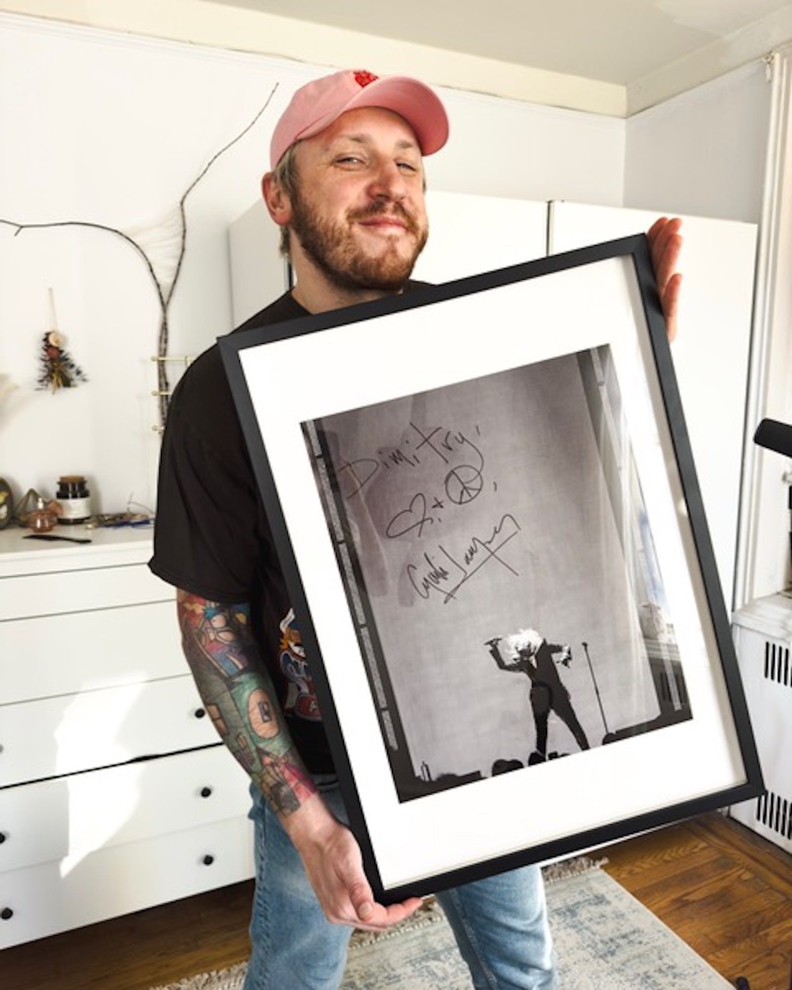 Photographer Dimitry Mak with his signed photo of Cyndi Lauper
