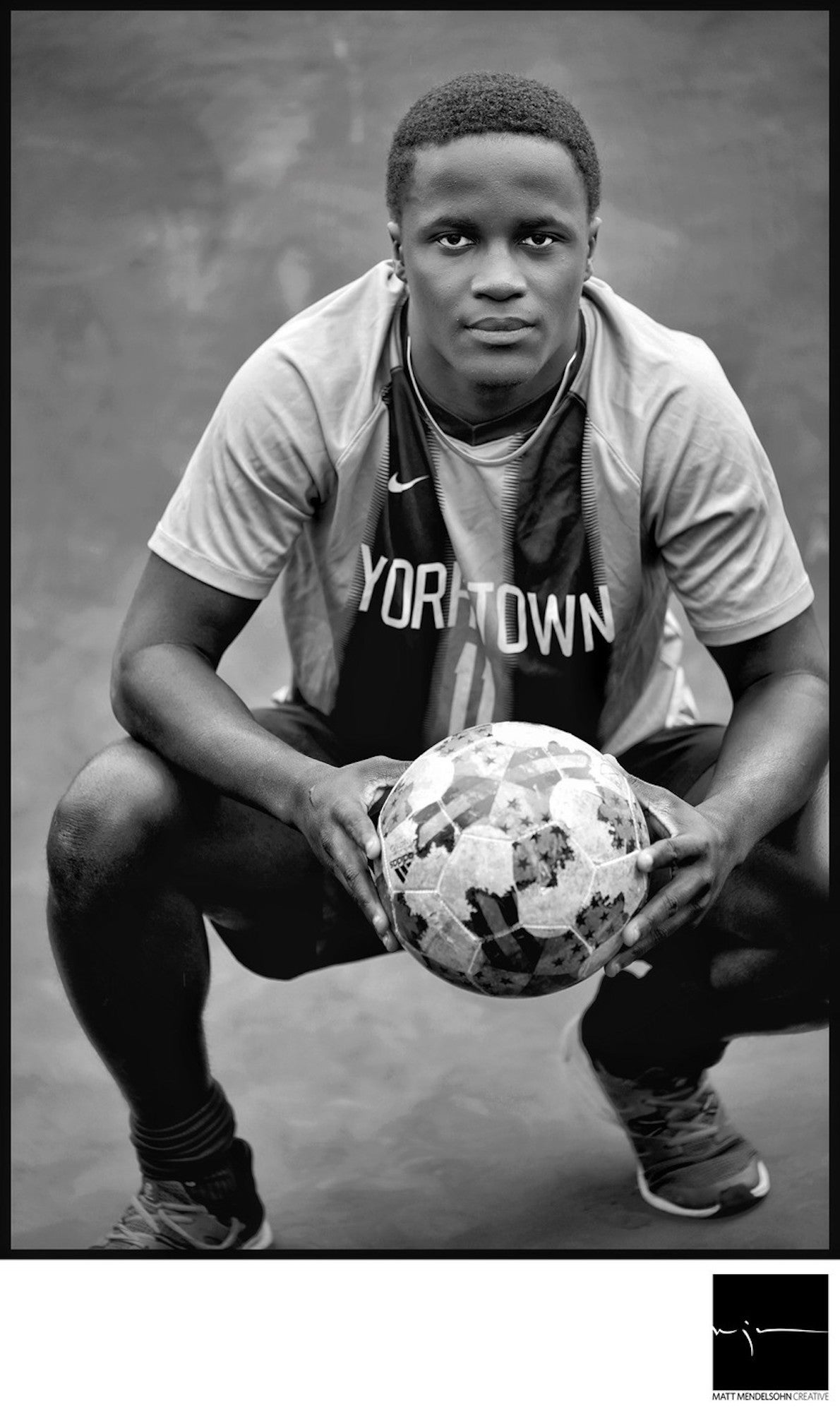 Alpha-Universe-Matt-Mendelsohn-senior-soccer-player-pius-kneeling-holding-soccer-ball.jpeg Alpha-Universe-Matt-Mendelsohn-senior-soccer-player-pius-kneeling-holding-soccer-ball.jpeg