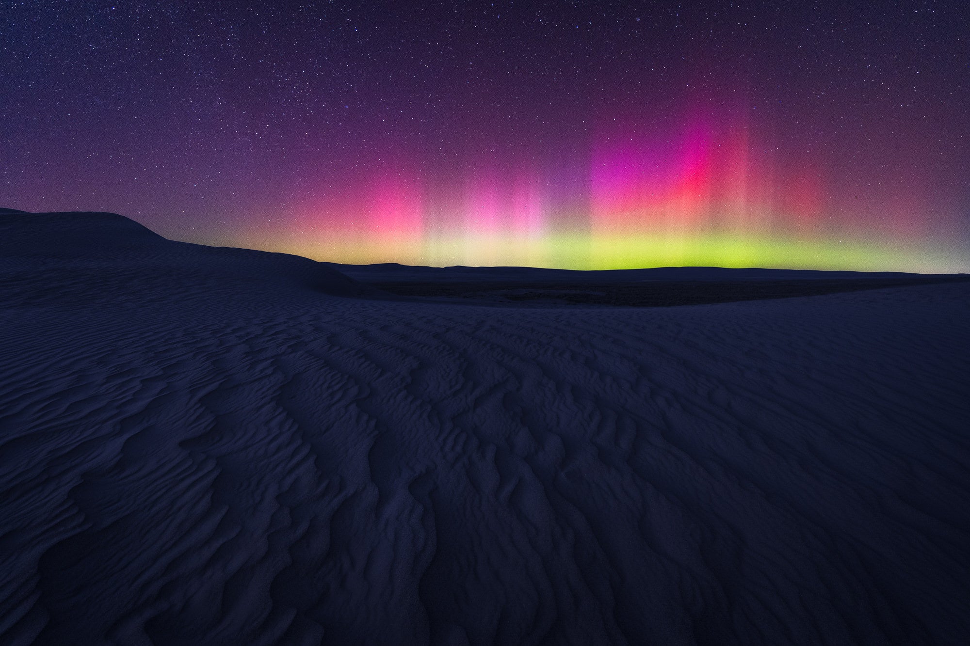 The Northern Lights above some sand dunes in eastern Washington State. Photo by Dylan McMains. Sony Alpha 7 III. Sony 16-35mm f/2.8 G Master. 10-sec., f/2.8, ISO 3200