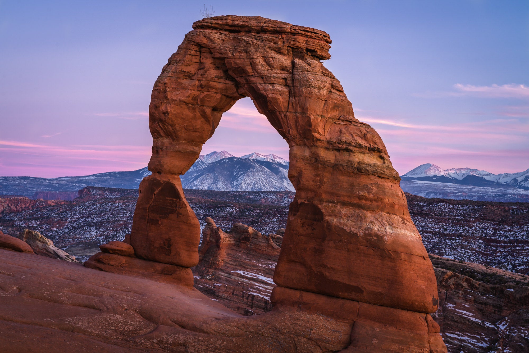 A post-sunset glow on the famous Delicate Arch in Utah&rsquo;s Arches National Park. Photo by Dylan McMains. Sony Alpha 7R II. Sony 85mm f/1.8. 1/13-sec., f/11, ISO 100