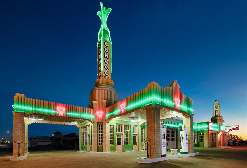 Lit-up Conoco station in Texas at blue hour
