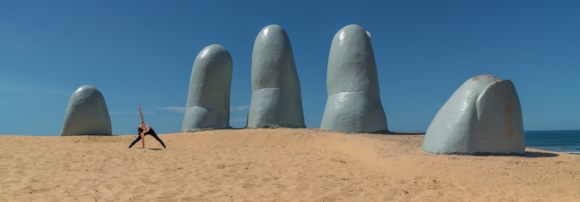 Woman doing yoga pose in Punta del Este Uruguay