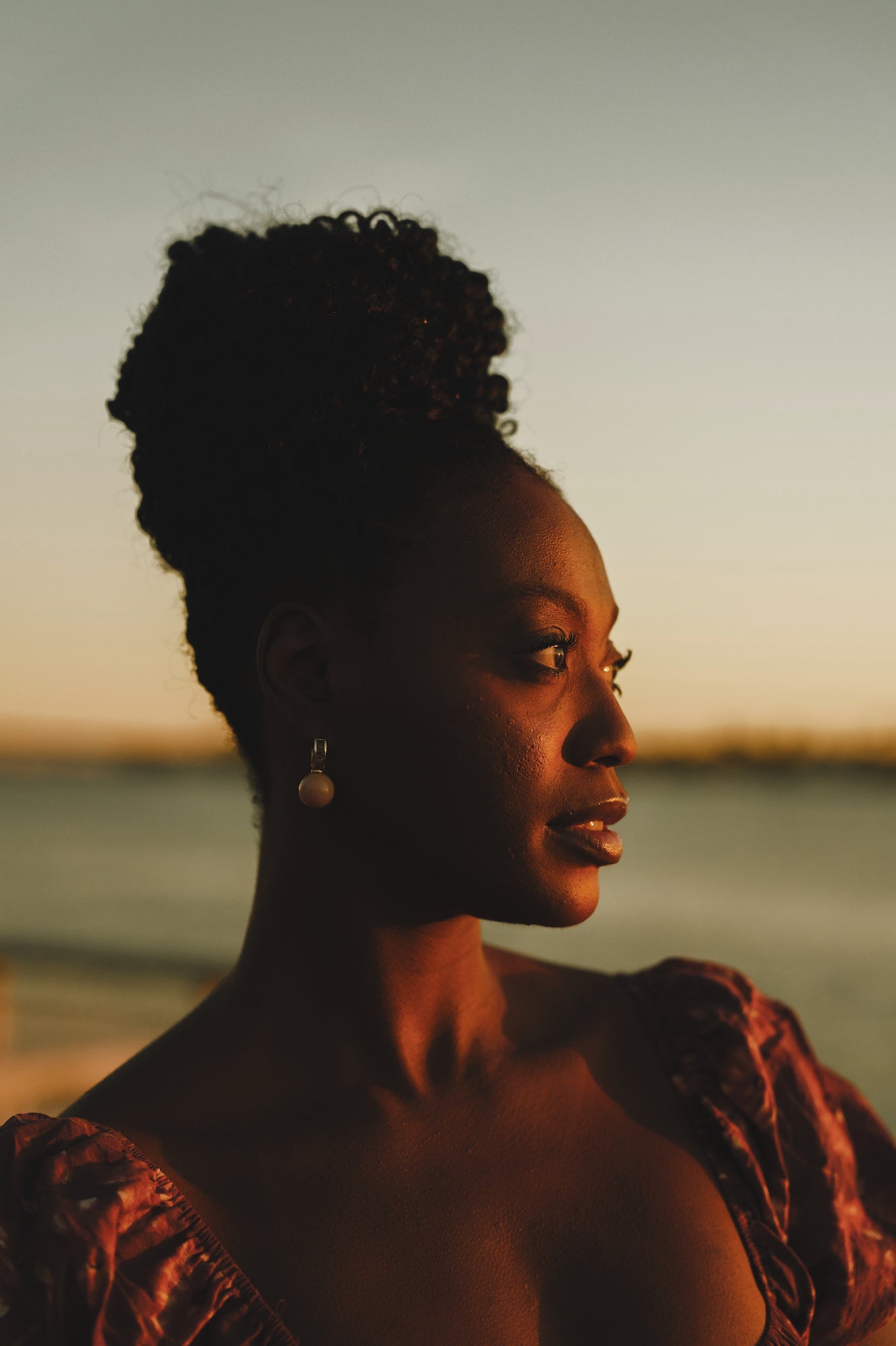 Golden‑hour close-up portrait of a woman in a floral dress, soft coastal light, Sony Creative Space San Diego. Golden‑hour close-up portrait of a woman in a floral dress, soft coastal light, Sony Creative Space San Diego.