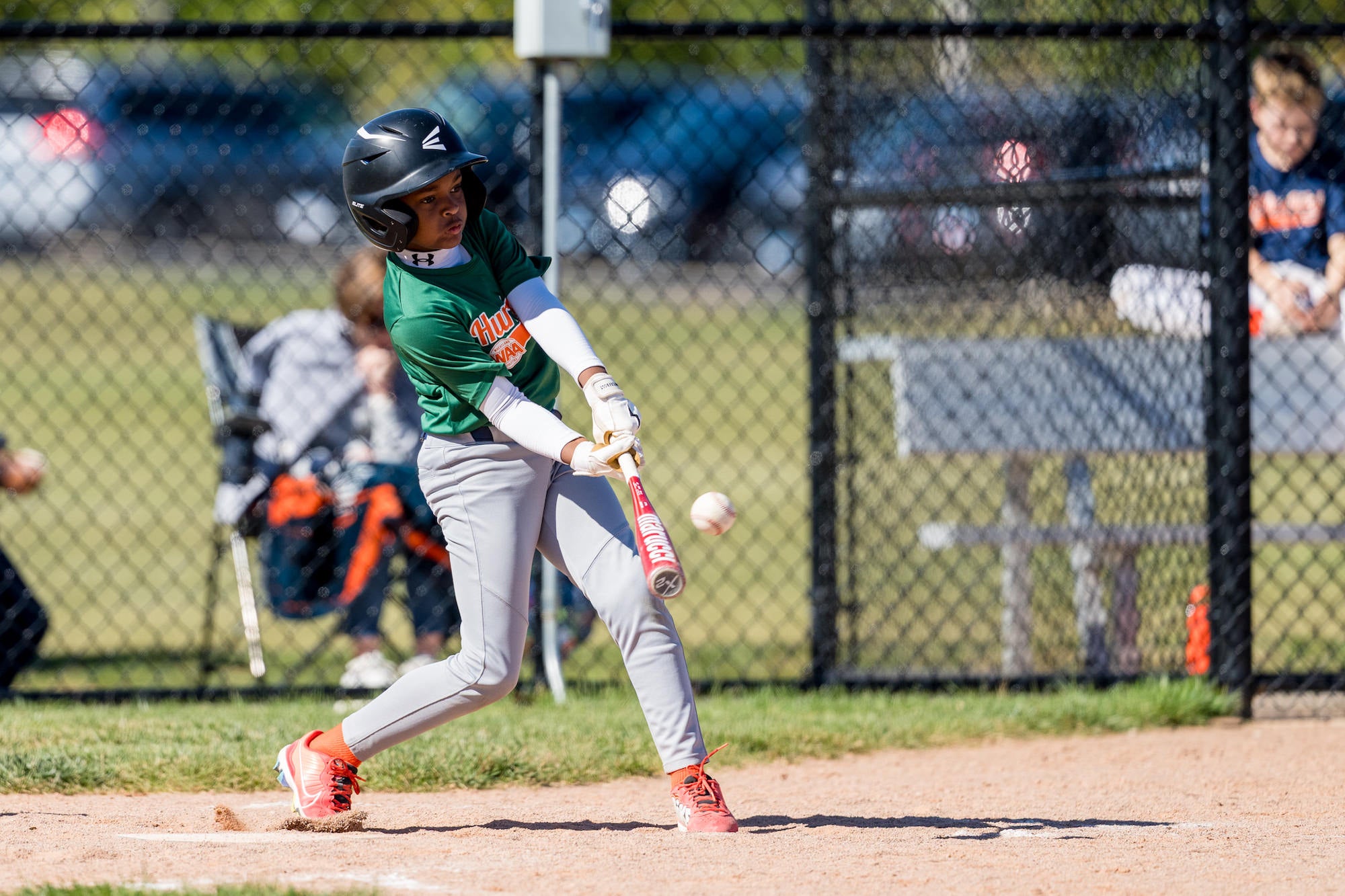 Batter drives the ball from the right side, bat flexing on contact, shallow depth of field. Batter drives the ball from the right side, bat flexing on contact, shallow depth of field.