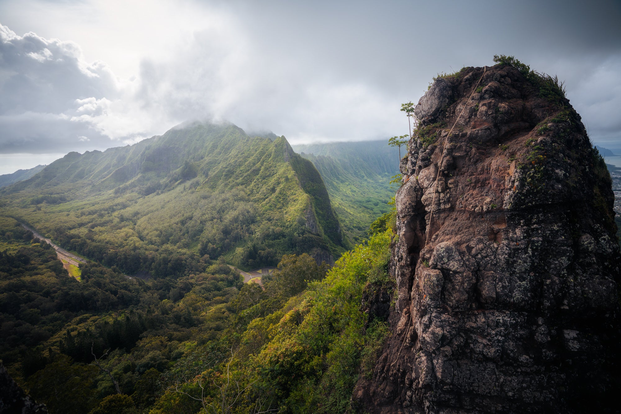 Lush green ridges and valley under low clouds on Oahu&rsquo;s Ko&lsquo;olau Range, adventure landscape by Paul Clark.