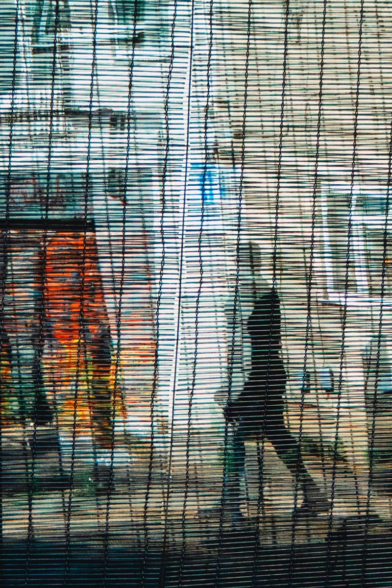 jpg/urban-silhouette-behind-wire-screen-reflection-street-scene-1200_boundscbds7o.jpg?height=1200&fit=bounds